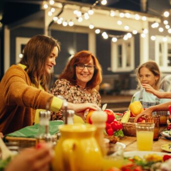 Family eating dinner outside 2227481211
