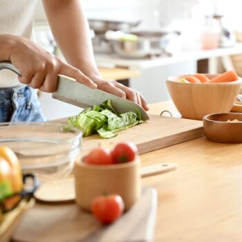 Lady chopping lettuce 2476751569