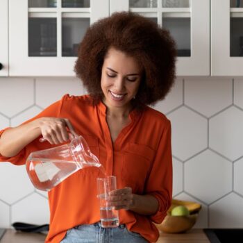 Lady pouring water 2300182895