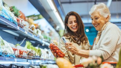 Mum and daughter in supermarket 2545068841