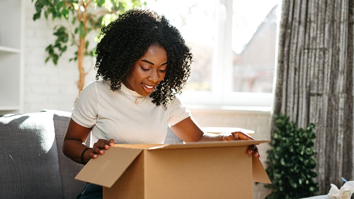 Lady opening package 2235507739