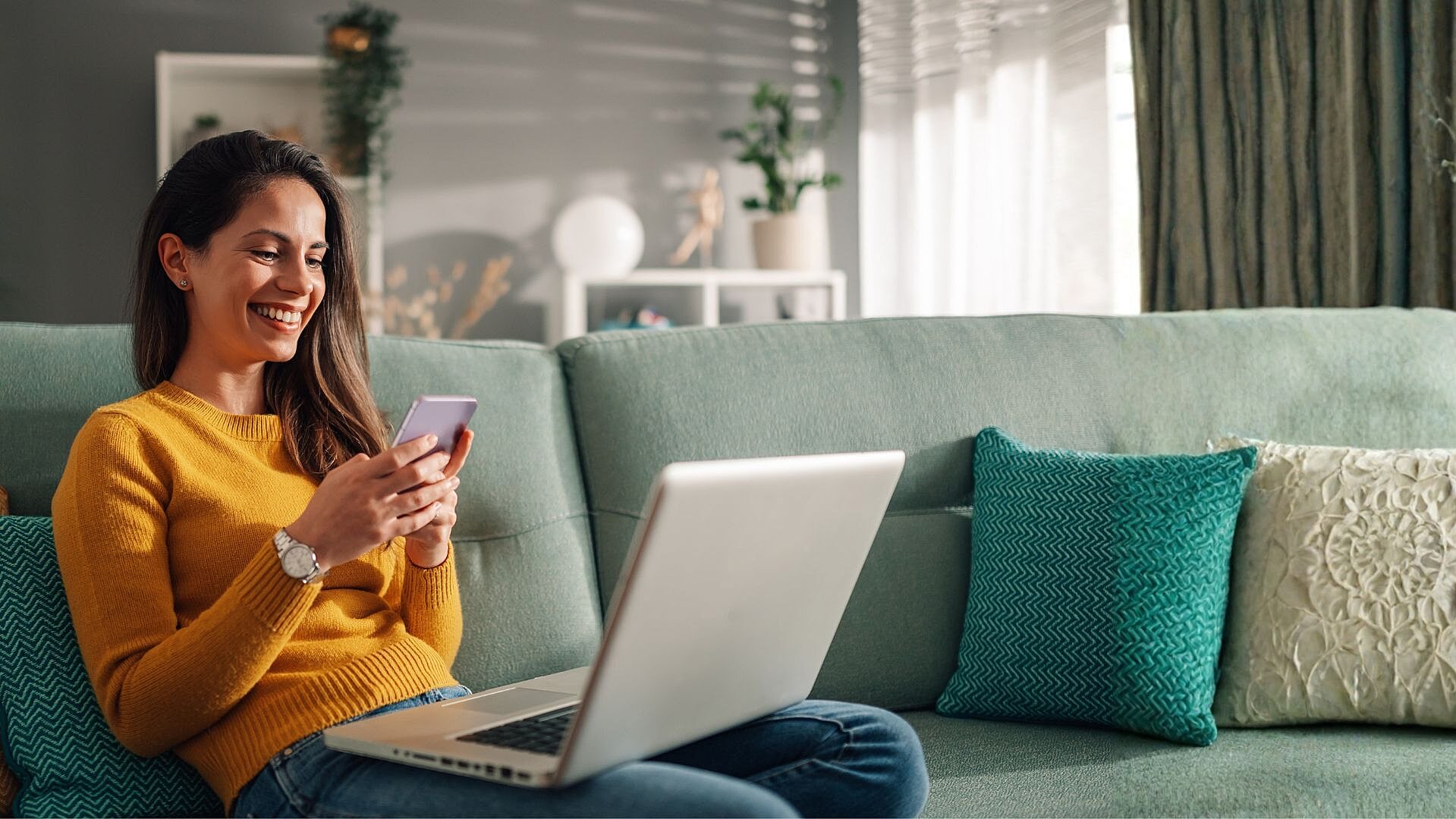 Lady smiling using laptop v4 2418478753