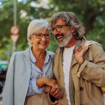 Couple walking laughing together 2213005407