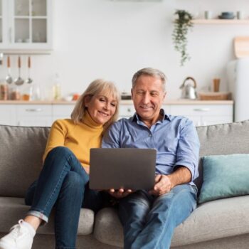 Cropped couple using laptop together v2 2492074159
