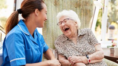 Nurse laughing with elderly patient 1178442679