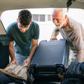Grandad and son packing car boot 2363986497